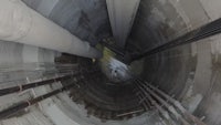 the inside of a tunnel with pipes and pipes